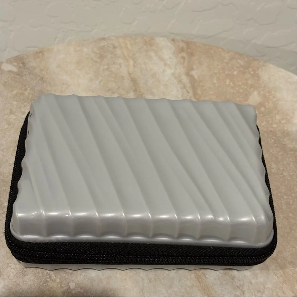 Tumi hard suitcase style cosmetic case